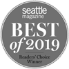 A circular badge with "Seattle Magazine Best of 2019 Readers' Choice Winner" in white text on a gray background.